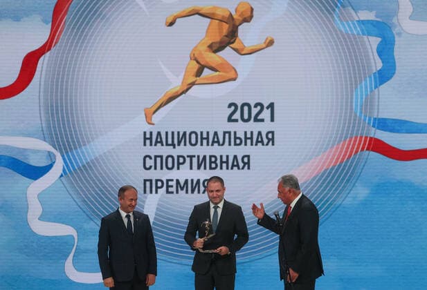 MOSCOW, RUSSIA - DECEMBER 8, 2021: Kemerovo Region Minister Sergei Myaus and Deputy Governor Sergei Alekseyev (L-R) accept the 2021 Russian National Sports Award for Best Region from Alexei Kulakovsky, Deputy Head of the Russian Presidential Directorate for Supporting State Council Activities, during a ceremony at Irina Viner-Usmanova Gymnastics Palace. Established in 2010 and coming with a million-rouble prize, the award is given to athletes, coaches, journalists and regional government officials who contributed to the promotion of Russian sports. Gavriil Grigorov TASS  0144161231st