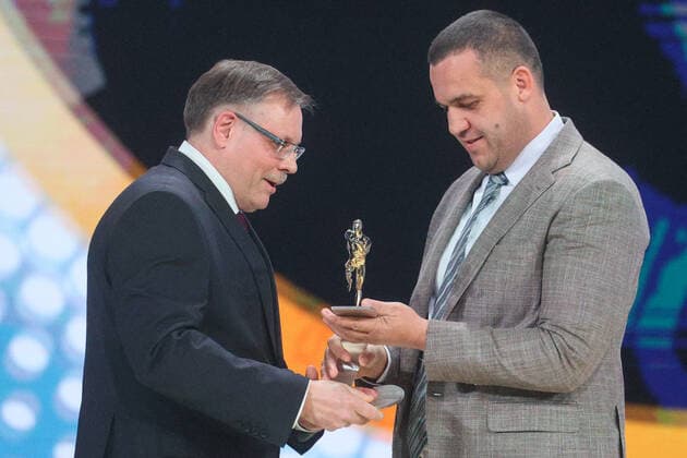 MOSCOW, RUSSIA - DECEMBER 8, 2021: Russian State University of Physical Education and professor Sergei Levushkin (L) accepts his 2021 Russian National Sports Award for Service to Sports from AIBA (International Boxing Association) President Umar Kremlev during a ceremony at Irina Viner-Usmanova Gymnastics Palace. Established in 2010 and coming with a million-rouble prize, the award is given to athletes, coaches, journalists and regional government officials who contributed to the promotion of Russian sports. Gavriil Grigorov TASS  0144163902st