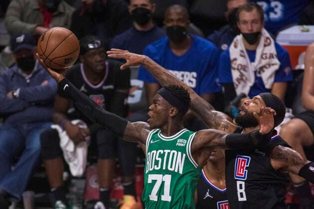December 8, 2021, Los Angeles, California, USA: Dennis Schroder 71 of the Boston Celtics goes for the net while Marcus Morris 8 of the Los Angeles Clippers attempts to block during their NBA, Basketball Herren, USA game on Wednesday December 8, 2021 at the Staples Center in Los Angeles, California. Clippers defeat Celtics, 114-111. ARIANA RUIZ PI Los Angeles USA - ZUMAp124 20211208_zaa_p124_004 Copyright: xArianaxRuizx