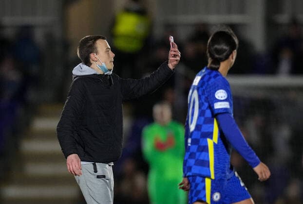 A pitch invader tries to take selfies with Sam Kerr of Chelsea during the UEFA Women s Champions League match between Chelsea Women and Juventus at the Kingsmeadow Stadium, Kingston, England on 8 December 2021. Copyright: xAndyxRowlandx PMI-4604-0014
