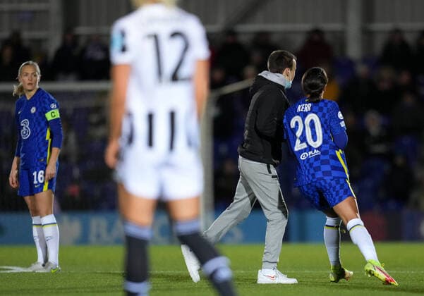 Sam Kerr of Chelsea shoulder barges a pitch invader during the UEFA Women s Champions League match between Chelsea Women and Juventus at the Kingsmeadow Stadium, Kingston, England on 8 December 2021. Copyright: xAndyxRowlandx PMI-4604-0016