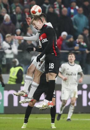 WARSAW, POLAND - DECEMBER 9, 2021: Spartak s Nail Umyarov heads the ball in the 2021 22 UEFA Europa League Group C Round 6 match between Spartak Moscow and Legia Warsaw at the Marshall Jozef Pilsudski s Municipal Stadium of Legia Warsaw. Alexander Demianchuk TASS  TS11B4A4