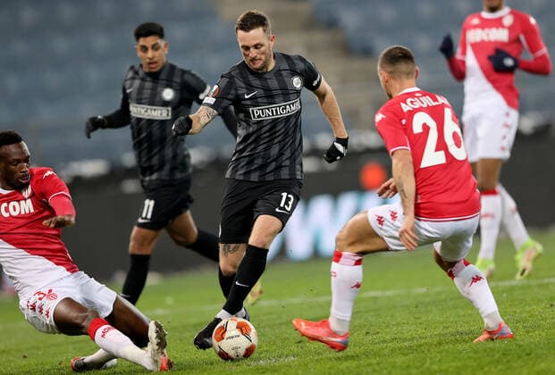 SOCCER - UEFA EL, Sturm vs Monaco GRAZ,AUSTRIA,09.DEC.21 - SOCCER - UEFA Europa League, group stage, SK Sturm Graz vs AS Monaco. Image shows Chrislain Matsima (Monaco), Jakob Jantscher (Sturm) and Ruben Aguilar (Monaco).  GEPAxpictures xMJxPaul