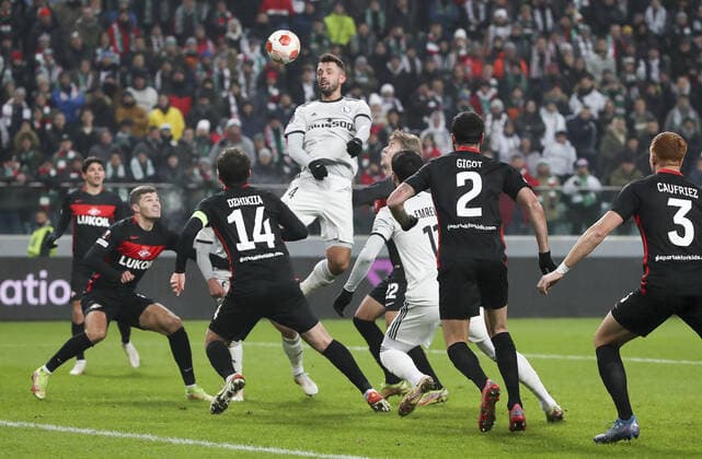 WARSAW, POLAND - DECEMBER 9, 2021: Spartak s Georgy Dzhikiya (3rd L), Legia s Mateusz Wieteska (4th L) in action in the 2021 22 UEFA Europa League Group C Round 6 match between Spartak Moscow and Legia Warsaw at the Marshall Jozef Pilsudski s Municipal Stadium of Legia Warsaw. Alexander Demianchuk TASS  TS11B4B6