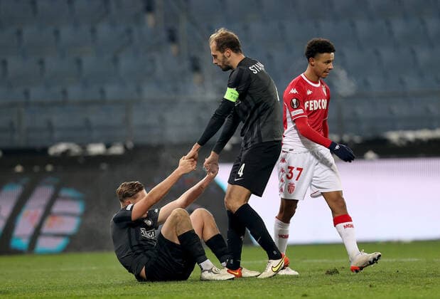 SOCCER - UEFA EL, Sturm vs Monaco GRAZ,AUSTRIA,09.DEC.21 - SOCCER - UEFA Europa League, group stage, SK Sturm Graz vs AS Monaco. Image shows Alexander Prass, Jon Gorenc-Stankovic (Sturm) and Sofiane Diop (Monaco).  GEPAxpictures xMJxPaul