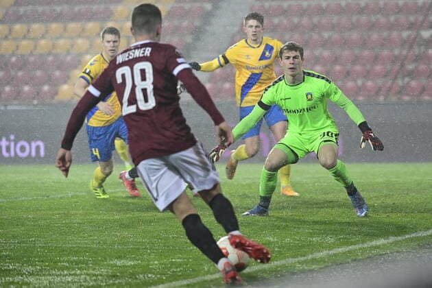 Tomas Wiesner of Sparta, left, and Mads Hermansen of Brondby in action during the UEFA Europa League group A soccer match Sparta Praha vs Brondby Copenhagen in Prague, Czech Republic, December 9, 2021. (CTKxPhoto RomanxVondrous) CTKPhotoP2021120908687 