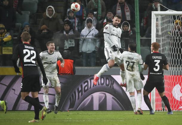 WARSAW, POLAND - DECEMBER 9, 2021: Spartak s Mikhail Ignatov, Legia s Mattias Johansson, Mateusz Wieteska, Josue, and Spartak s Maximiliano Caufriez (L-R) in action in the 2021 22 UEFA Europa League Group C Round 6 match between Spartak Moscow and Legia Warsaw at the Marshall Jozef Pilsudski s Municipal Stadium of Legia Warsaw. Alexander Demianchuk TASS  TS11B4CD