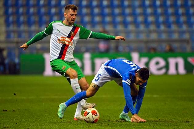 GENK, BELGIUM - DECEMBER 09 : Christoph Knasmullner midfielder of SK Rapid Wien, Gerardo Arteaga defender of KRC Genk during the UEFA Europa League Group stage H match between KRC Genk and SK Rapid Wien on December 9, 2021 in Genk, Belgium, 9 12 2021 ( KRC Genk v Rapid Wien - UEFA Europa League PhotoNews Panoramic 