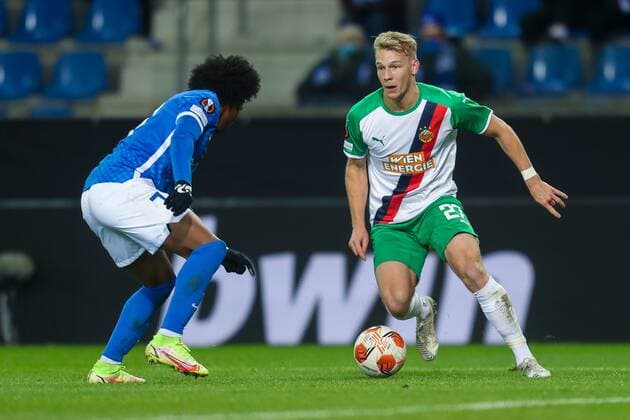 SOCCER - UEFA EL, Genk vs Rapid GENK,BELGIUM,09.DEC.21 - SOCCER - UEFA Europa League, group stage, KRC Genk vs SK Rapid Wien. Image shows Angelo Preciado (Genk) and Marco Gruell (Rapid).  GEPAxpictures xPhilippxBrem