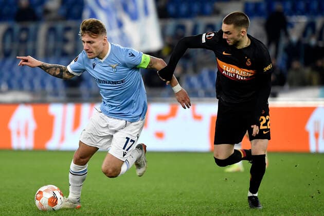 Ciro Immobile of SS Lazio and Berkan Kutlu of Galatasaray compete for the ball during the Europa League group stage football match between SS Lazio and Galatasaray at Olimpico stadium in Rome (Italy), December 9th, 2021. Photo Antonietta Baldassarre Insidefoto antoniettaxbaldassarre
