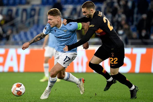 Ciro Immobile of SS Lazio and Berkan Kutlu of Galatasaray compete for the ball during the Europa League group stage football match between SS Lazio and Galatasaray at Olimpico stadium in Rome (Italy), December 9th, 2021. Photo Antonietta Baldassarre Insidefoto antoniettaxbaldassarre