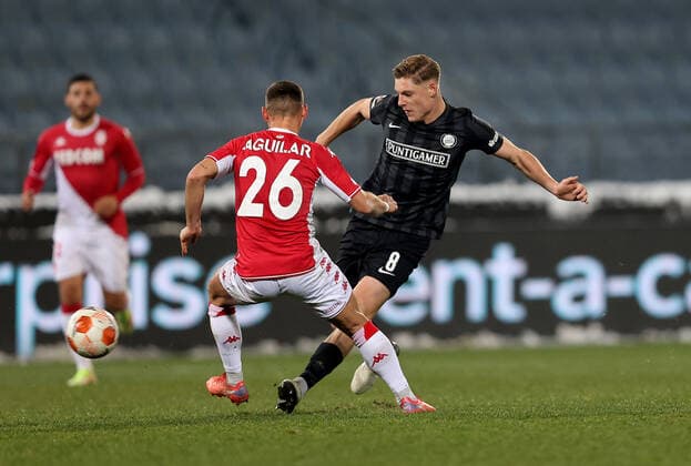SOCCER - UEFA EL, Sturm vs Monaco GRAZ,AUSTRIA,09.DEC.21 - SOCCER - UEFA Europa League, group stage, SK Sturm Graz vs AS Monaco. Image shows Ruben Aguilar (Monaco) and Alexander Prass (Sturm).  GEPAxpictures xMJxPaul