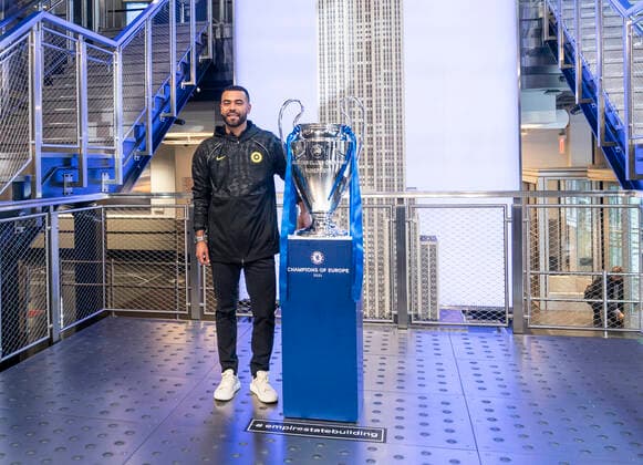 Chelsea FC legend Ashley Cole with Champions League Trophy at Empire State Building Chelsea FC legend Ashley Cole poses with Champions League Trophy on Grand Staircase of the Empire State Building New York New York United States Copyright: LevxRadin