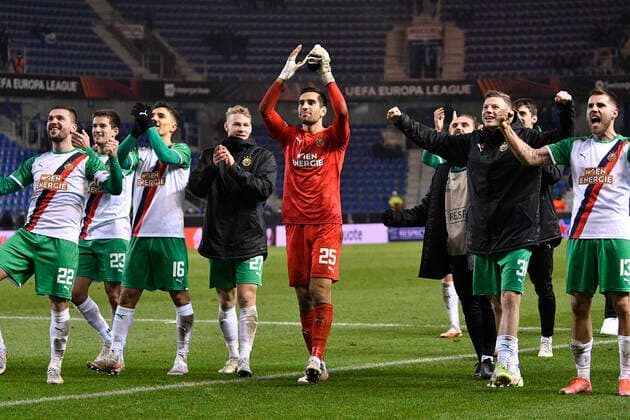 Rapid Wien s players celebrate after winning a game between Belgian soccer team KRC Genk and Austrian soccer team SK Rapid Wien, Thursday 09 December 2021, in Genk, in the group H of the Europa League group stage, on the sixth and last day. JOHANxEYCKENS  x3153109x
