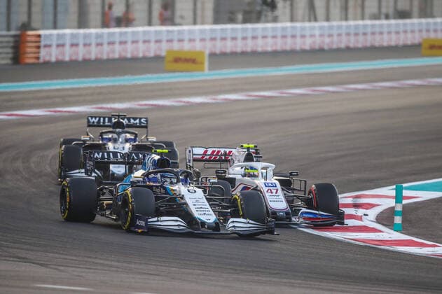 06 LATIFI Nicholas (can), Williams Racing F1 FW43B, action and 47 SCHUMACHER Mick (ger), Haas F1 Team VF-21 Ferrari during the Formula 1 Etihad Airways Abu Dhabi Grand Prix 2021, 22th round of the 2021 FIA Formula One World Championship, WM, Weltmeisterschaft from December 10 to 12, 2021 on the Yas Marina Circuit, in Yas Island, Abu Dhabi - F1 - ABU DHABI GRAND PRIX 2021 - RACE DPPI Panoramic  20211212_GOODEN_FGO00577
