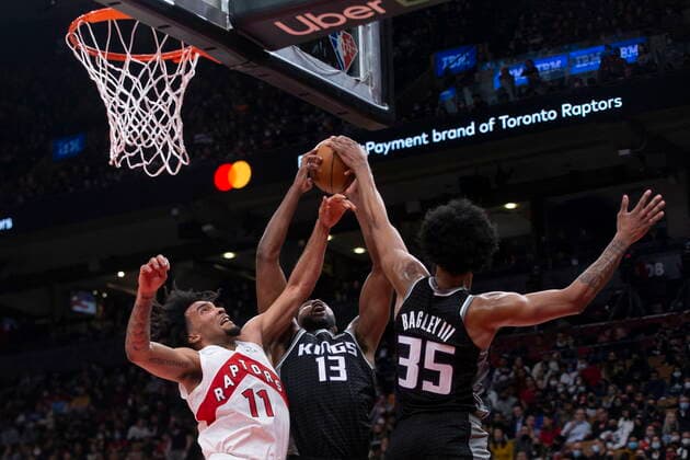 December 13, 2021, Toronto, ON, CANADA: Sacramento Kings Tristan Thompson (13) and teammate Marvin Bagley III battle for a rebound with Toronto Raptors Justin Champagnie during second half NBA, Basketball Herren, USA basketball action in Toronto, Monday, Dec. 13, 2021. Tristan Thompson; Marvin Bagley III ; Justin Champagnie  - ZUMAc35_ 20211213_zaf_c35_108 Copyright: xChrisxYoungx