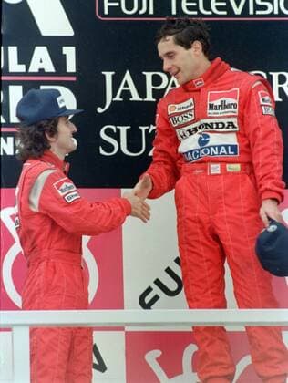Auto racing: Ayrton Senna and Alain Prost in 1988 File photo taken in October 1988 shows Brazilian racing driver Ayrton Senna (R) being celebrated by Alain Prost of France after winning the Japanese Grand Prix at Suzuka Circuit in Mie Prefecture.  A14AA0001174676P