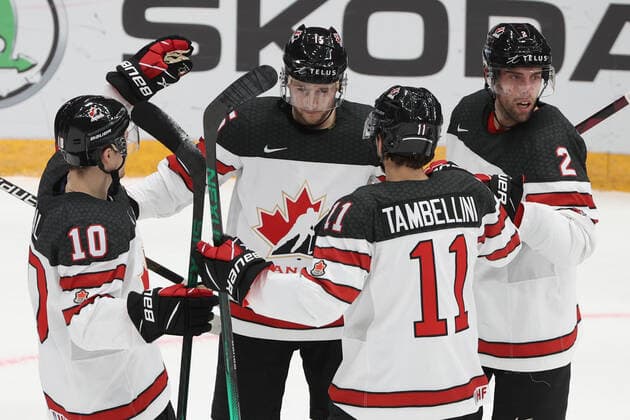 MOSCOW, RUSSIA â€“ DECEMBER 17, 2021: Canadian players celebrate a goal scored against Sweden in their national teamsâ€™ 2021 Channel One Cup Ice hockey, Eishockey match at CSKA Arena as part of the 2021 22 Euro Hockey Tour. Valery Sharifulin TASS  TS11C2C3