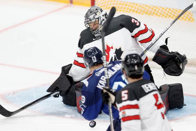 MOSCOW, RUSSIA â€“ DECEMBER 18, 2021: Canadaâ€™s Justin Pogge (back) defends the net in his national team, Nationalteam s 2021 Channel One Cup Ice hockey, Eishockey match against Finland at CSKA Arena as part of the 2021 22 Euro Hockey Tour. Mikhail Japaridze TASS  TS11C463