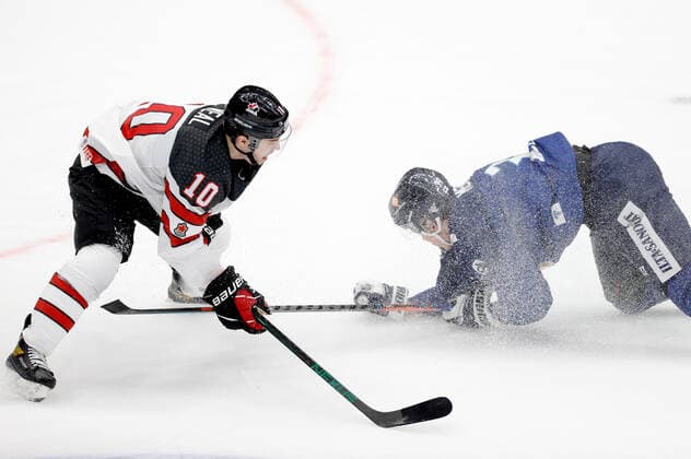 MOSCOW, RUSSIA â€“ DECEMBER 18, 2021: Canadaâ€™s Jordan Weal (L) and Finlandâ€™s Waltteri Merela in their national teamsâ€™ 2021 Channel One Cup Ice hockey, Eishockey match at CSKA Arena as part of the 2021 22 Euro Hockey Tour. Mikhail Japaridze TASS  TS11C46B