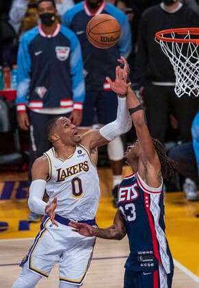 December 25, 2021, Los Angeles, California, USA: Russell Westbrook 0 of the Los Angeles Lakers puts up a shot over Nicolas Claxton 33 of the Brooklyn Nets during their NBA, Basketball Herren, USA home game on Saturday December 25, 2021 at Crypto.com Arena in Los Angeles, California. Lakers lose to Nets, 115-122. PI Los Angeles USA - ZUMAp124 20211225_zaa_p124_012 Copyright: xJAVIERxROJASx