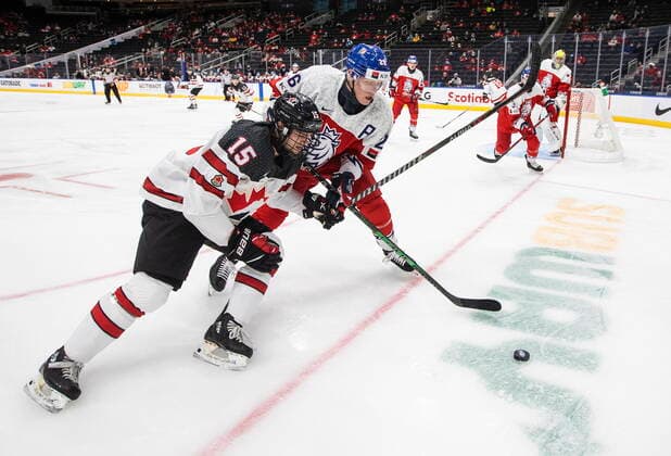 December 26, 2021, EDMONTON, AB, CANADA: Canada s Shane Wright (15) and Czech Republic s Michal Gut (26) battle for the puck during first period IIHF World Junior Hockey Championship action in Edmonton on Sunday, December 26, 2021. Shane Wright Michal Gut  - ZUMAc35_ 20211226_zaf_c35_077 Copyright: xJasonxFransonx