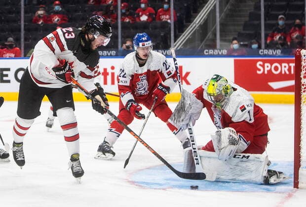December 26, 2021, EDMONTON, AB, CANADA: Canada s Mason McTavish (23) is stopped by Czech Republic s Jakub Malek (1) during first period IIHF World Junior Hockey Championship action in Edmonton on Sunday, December 26, 2021. Mason McTavish Jakub Malek  - ZUMAc35_ 20211226_zaf_c35_078 Copyright: xJasonxFransonx