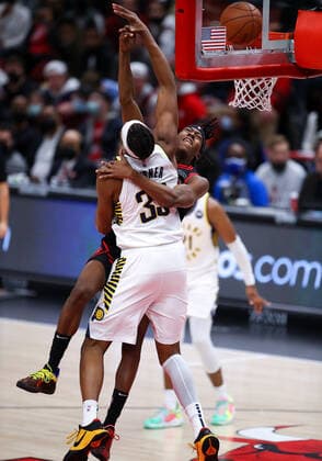 CHICAGO, IL - DECEMBER 26: Chicago Bulls Guard Ayo Dosunmu (12) is fouled while attempting to slam dunk the ball during a NBA, Basketball Herren, USA game between the Indiana Pacers and the Chicago Bulls on December 26, 2021 at the United Center in Chicago, IL. (Photo by Melissa Tamez Icon Sportswire) NBA: DEC 26 Pacers at Bulls Icon2112261616