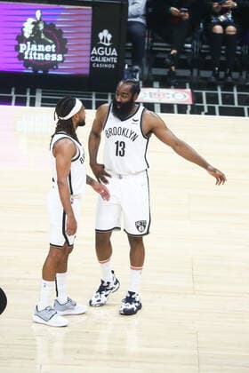 LOS ANGELES, CA - DECEMBER 27: Brooklyn Nets Guard James Harden (13) talks with teammate Brooklyn Nets Guard Patty Mills (8) as the Los Angeles Clippers face off against the Brooklyn Nets at Crypto.com Arena on Monday, December 27, 2021 in Los Angeles, CA. (Photo by Will Navarro Icon Sportswire) NBA, Basketball Herren, USA DEC 27 Nets at Clippers Icon2112270008