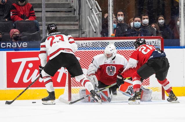 December 28, 2021, EDMONTON, AB, CANADA: Canada s Mason McTavish (23) is stopped by Austria s goalie Leon Sommer (1) as Johannes Tschurnig (26) defends during first period IIHF World Junior Hockey Championship action in Edmonton on Tuesday, December 28, 2021. Mason McTavish Leon Sommer Johannes Tschurnig  - ZUMAc35_ 20211228_zaf_c35_059 Copyright: xJasonxFransonx