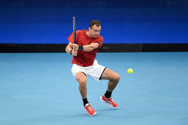 SYDNEY, AUSTRALIA - JANUARY 02: Roman Safiullin of Russia plays a backhand during the ATP, Tennis Herren Cup Tennis match between Roman Safiullin of Russia and Arthur Rinderknech of France at Ken Rosewall Arena on January 02, 2022 in Sydney, Australia. (Photo by Steven Markham Icon Sportswire) TENNIS: JAN 02 ATP Cup Sydney Icon2201020038