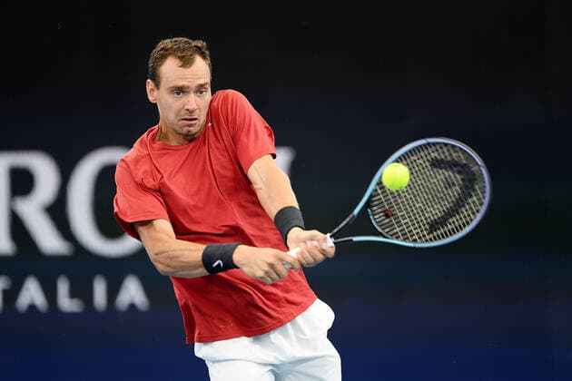 SYDNEY, AUSTRALIA - JANUARY 02: Roman Safiullin of Russia plays a backhand during the ATP, Tennis Herren Cup Tennis match between Roman Safiullin of Russia and Arthur Rinderknech of France at Ken Rosewall Arena on January 02, 2022 in Sydney, Australia. (Photo by Steven Markham Icon Sportswire) TENNIS: JAN 02 ATP Cup Sydney Icon2201020005