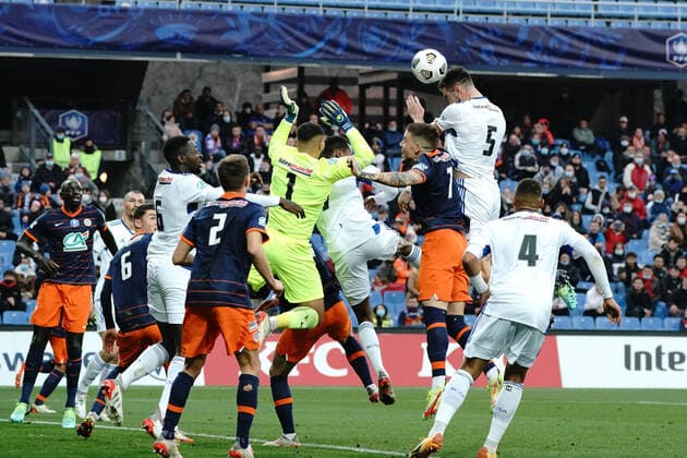 Lucas Perrin (Strasbourg) - Dimitry Bertaud (Montpellier FC) - Mihailo Ristic (Montpellier FC) FOOTBALL : Montpellier vs Strasbourg - 16eme de finale de coupe de France - Montpellier - 02 01 2022 NorbertScanella Panoramic 