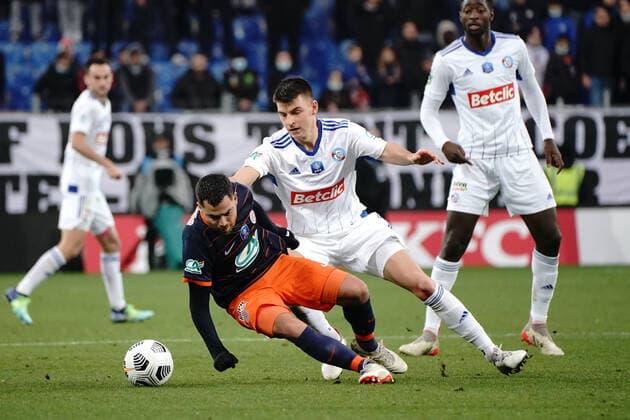 Teji Savanier (Montpellier FC) - Frederic Guilbert (Strasbourg) FOOTBALL : Montpellier vs Strasbourg - 16eme de finale de coupe de France - Montpellier - 02 01 2022 NorbertScanella Panoramic 