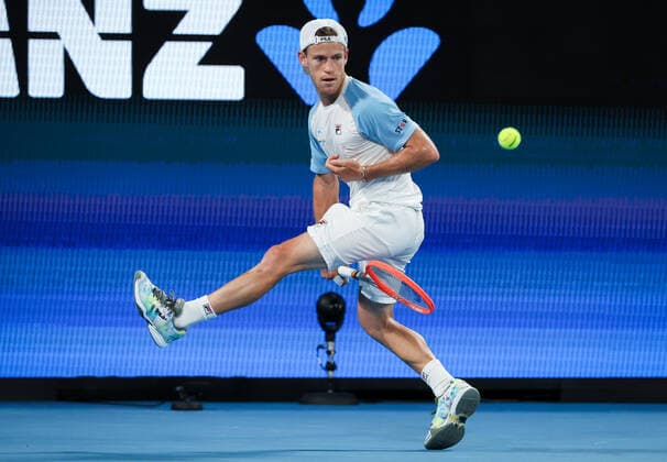 TENNIS ATP, Tennis Herren CUP, Diego Schwartzman of Team Argentina hits a shot between his legs during his match against Stefanos Tsitsipas of Team Greece on day 3 of the ATP Cup tennis tournament at Qudos Arena in Sydney, Monday, January 3, 2022. ( NO ARCHIVING, EDITORIAL USE ONLY, NO USE IN BOOKS WITHOUT CONSENT SYDNEY NSW AUSTRALIA  Copyright: xDAVIDxGRAYx 20220103001610531943