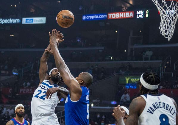 January 3, 2022, Los Angeles, California, USA: Patrick Beverley 22 of the Minnesota Timberwolves puts a shot over Serge Ibaka 9 of the Los Angeles Clippers during their NBA, Basketball Herren, USA game on Monday January 3, 2022 at Crypto.com Arena in Los Angeles, California. Clippers lose to Timberwolves, 104-122. PI Los Angeles USA - ZUMAp124 20220103_zaa_p124_002 Copyright: xJAVIERxROJASx