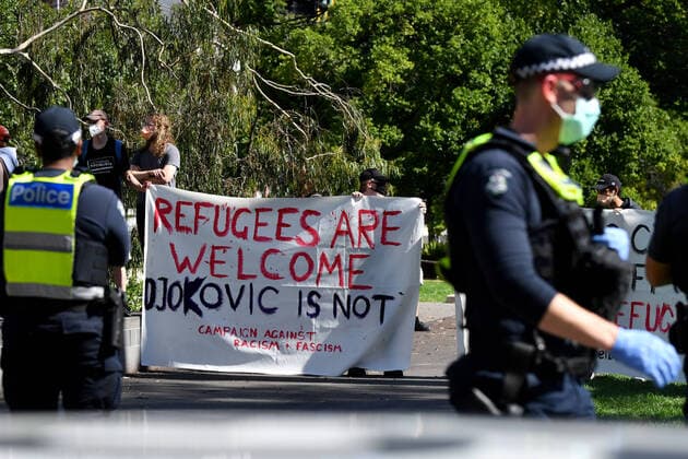 TENNIS NOVAK DJOKOVIC VISA, Pro-refugee activists carry banners outside outside the Park hotel quarantine facility where it is believed Serbian tennis player Novak Djokovic is being detained in Melbourne, Friday, January 7, 2022. World No.1 tennis star Novak Djokovic is fighting his visa cancellation and pending deportation in a Federal Court challenge. ( NO ARCHIVING, EDITORIAL USE ONLY, NO USE IN BOOKS WITHOUT CONSENT MELBOURNE VIC AUSTRALIA  Copyright: xJOELxCARRETTx 20220107001611458421
