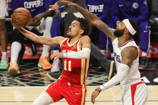 Trae Young 11 of the Atlanta Hawks drives for a layup past defender Marcus Morris Sr. 8 of the LA Clippers, during a basketball match between Los Angeles Clippers and Atlanta Hawks, at Crypto.com Arena in Los Angeles, US, 9 January 2022. Los Angeles Clippers vs Atlanta Hawks !ACHTUNG: NUR REDAKTIONELLE NUTZUNG!  Copyright: xPHILLIPxKIMx AME8104 20220109-9bbef43343a42edddf8912dbaf8a522de8f82e7d