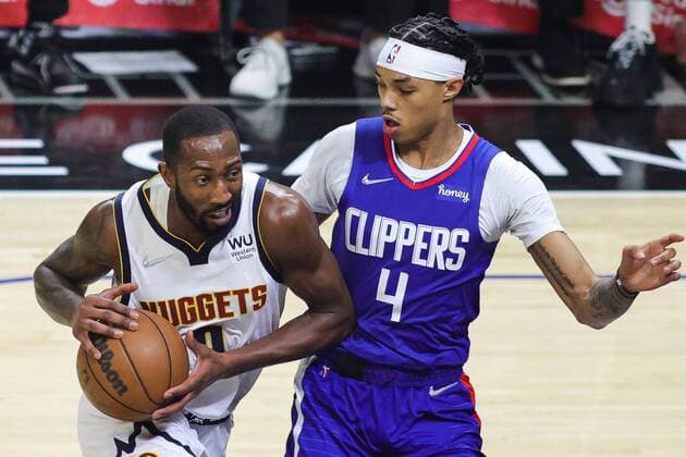Davon Reed (L) of the Nuggets disputes a ball with Brandon Boston Jr. of the Clippers, during an NBA, Basketball Herren, USA game between the Los Angeles Clippers and the Denver Nuggets, at the Crypto.com Arena in Los Angeles (United States). Los Angeles Clippers vs Denver Nuggets !ACHTUNG: NUR REDAKTIONELLE NUTZUNG!  Copyright: xPhillipxKimx AME8448 20220112-0e973155ab10a3aaa8fd3e21d932aa93835b41fe