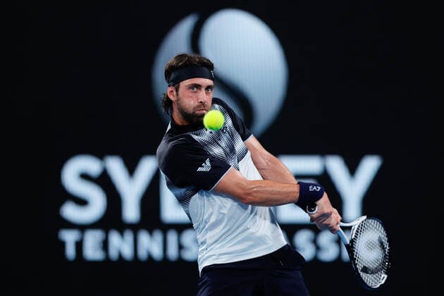 Nikoloz Basilashvili of Georgia plays a backhand against Andy Murray of Great Britain in the second round during the Sydney Tennis Classic 2022 at Sydney Olympic Park Tennis Centre, Sydney, Australia on 12 January 2022. Copyright: xPeterxDovganx 30470368