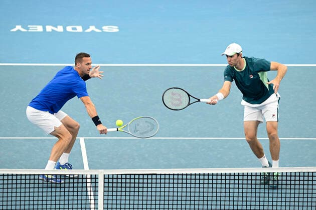 15th January 2022: Ken Rosewall Arena, Sydney Olympic Park, Sydney, Australia; Sydney Tennis Classic, Day 7 Mens Doubles Final: Filip Polasek of Slovakia hits a volley as doubles partner John Peers of Australia covers during their doubles match against Simone Bolelli and Fabio Fognini of Italy  ActionPlus12356180 NigelxOwen
