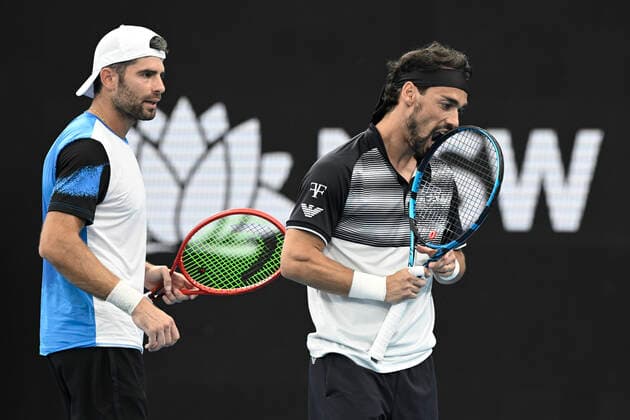15th January 2022: Ken Rosewall Arena, Sydney Olympic Park, Sydney, Australia; Sydney Tennis Classic, Day 7 Mens Doubles Final: Fabio Fognini of Italy bites his racquet after missing a shot as partner Simone Bolelli of Italy looks on  ActionPlus12356191 NigelxOwen