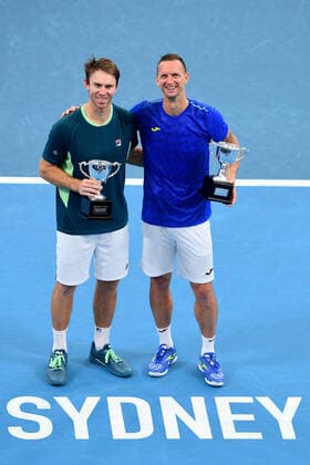 SYDNEY TENNIS CLASSIC, John Peers of Australia (left) and Filip Polasek of Slovakia pose with thier trophies after winning their doubles final match against Simone Bolelli and Fabio Fognini of Italy on Day 6 of the Sydney Tennis Classic at Sydney Olympic Park in Sydney, Saturday, January 15, 2022. ( NO ARCHIVING, EDITORIAL USE ONLY, NO USE IN BOOKS WITHOUT CONSENT SYDNEY NSW AUSTRALIA  Copyright: xDANxHIMBRECHTSx 20220115001613549066