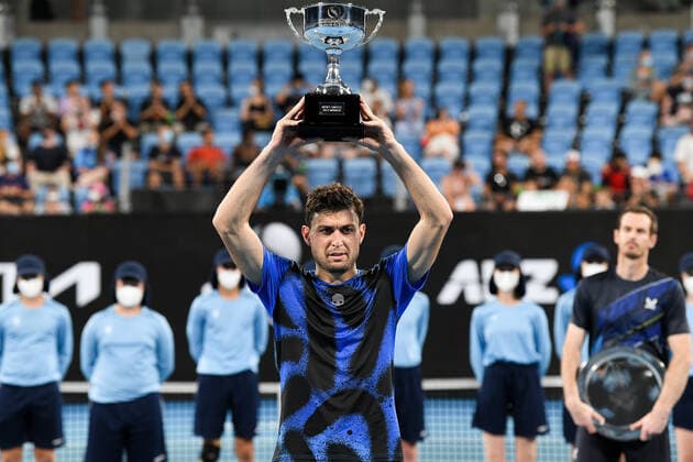 SYDNEY, AUSTRALIA - JANUARY 15: Aslan Karatsev of Russiaholds up the winners trophy after the Sydney Classic Tennis men s singles final between Andy Murray of Great Britain and Aslan Karatsev of Russia at Ken Rosewall Arena on January 15, 2022 in Sydney, Australia. (Photo by Steven Markham Icon Sportswire) TENNIS: JAN 15 Sydney Classic Icon2201150129