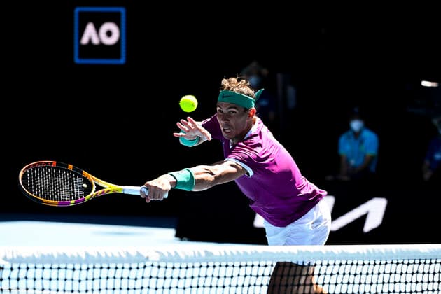 TENNIS AUSTRALIAN OPEN, Rafael Nadal of Spain plays a shot during his first Round Men s singles match against Marcos Giron of the United States on Day 1 of the Australian Open, at Melbourne Park, in Melbourne, Monday, January 17, 2022. ( NO ARCHIVING, EDITORIAL USE ONLY, NO USE IN BOOKS WITHOUT CONSENT MELBOURNE VIC AUSTRALIA  Copyright: xDAVExHUNTx 20220117001614144168