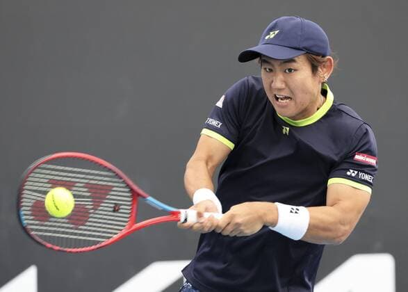 Tennis: Australian Open Yoshihito Nishioka of Japan plays in the men s singles first round against Moldova s Radu Albot at the Australian Open tennis championships in Melbourne on Jan. 17, 2022.  A14AA0001183190P
