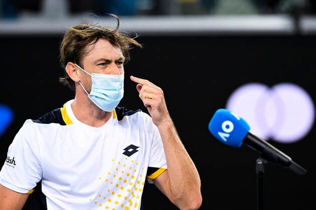 TENNIS AUSTRALIAN OPEN, John Millman of Australia wears his face mask to a post match interview after winning his first Round Men s singles match against Feliciano Lopez of Spain on Day 1 of the Australian Open, at Melbourne Park, in Melbourne, Monday, January 17, 2022. ( NO ARCHIVING, EDITORIAL USE ONLY, NO USE IN BOOKS WITHOUT CONSENT MELBOURNE VIC AUSTRALIA  Copyright: xDEANxLEWINSx 20220117001614186725