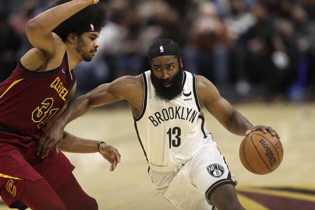 Brooklyn Nets James Harden (13) drives to the basket defended by Cleveland Cavaliers Jarrett Allen (31) at Rocket Mortgage Field House in Cleveland, Ohio on Monday, January 17, 2022.  CLE20220117106 AARONxJOSEFCZYK