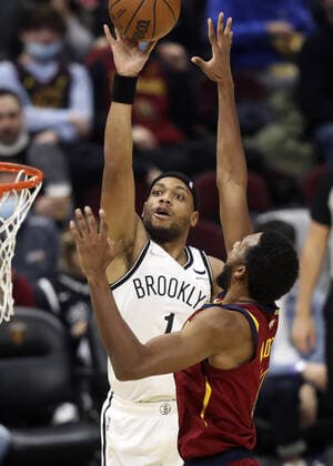 Brooklyn Nets Bruce Brown (1) shoots over Cleveland Cavaliers Evan Mobley (4) at Rocket Mortgage Field House in Cleveland, Ohio on Monday, January 17, 2022.  CLE20220117118 AARONxJOSEFCZYK