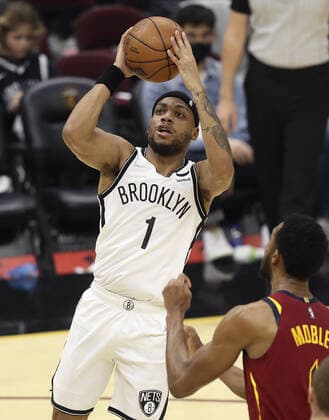 Brooklyn Nets Bruce Brown (1) puts up a shot over Cleveland Cavaliers Evan Mobley (4) at Rocket Mortgage Field House in Cleveland, Ohio on Monday, January 17, 2022.  CLE20220117130 AARONxJOSEFCZYK